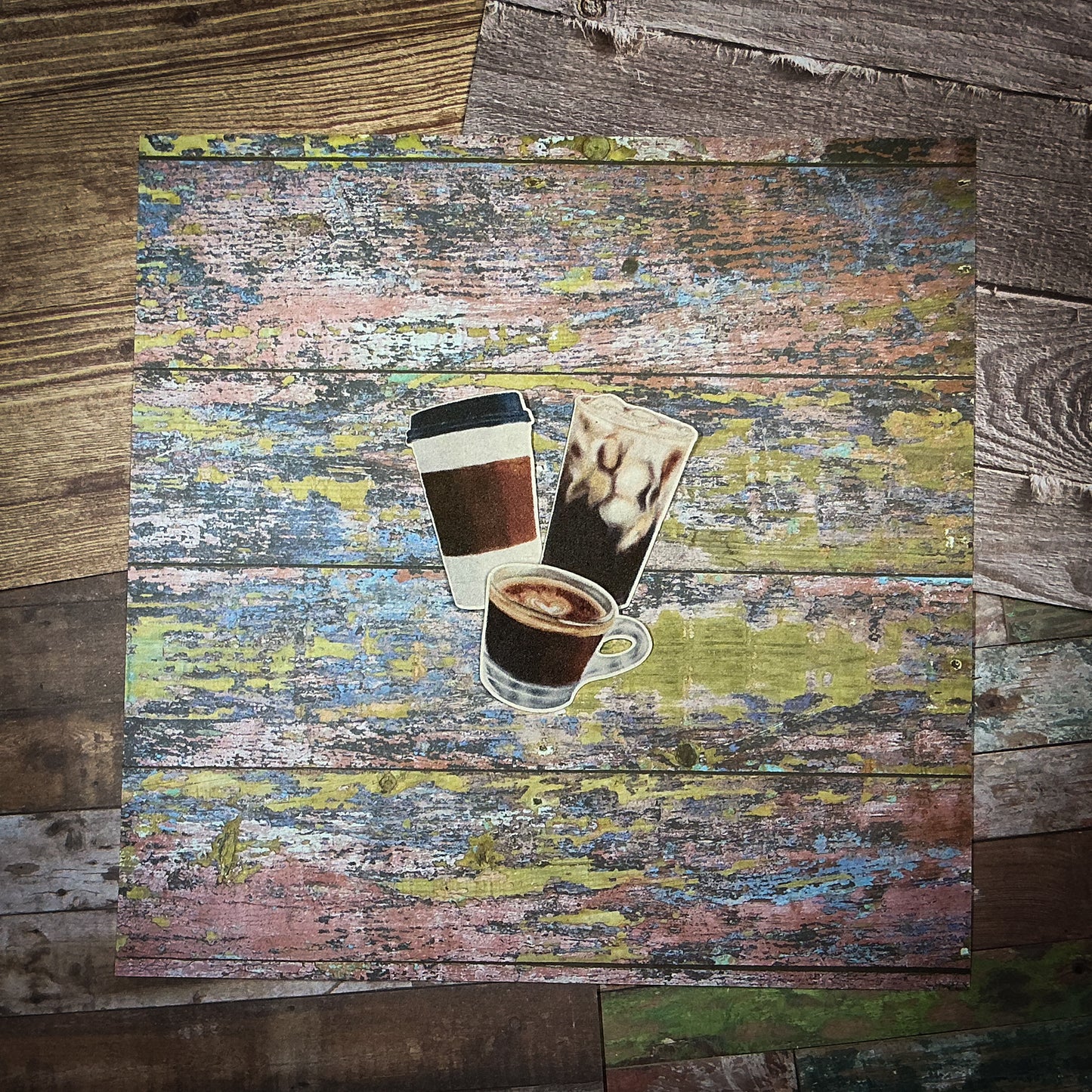3 Mini Coffee Stickers featuring hand drawn Espresso, Iced Coffee, and a To-Go Cup on top of an edgy textured wooden background